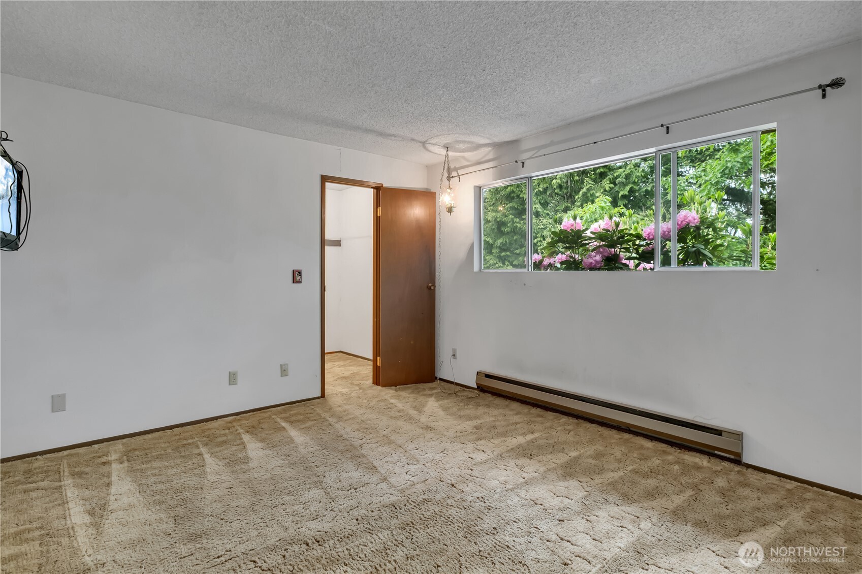 412 213th Place Southwest, Unit 21D Bothell, WA 98021 - Photo 19 of 28 a view of an empty room with a window