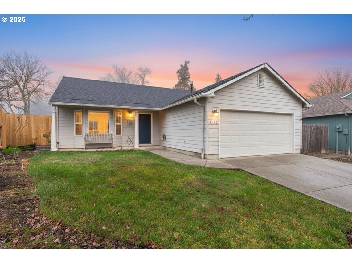 a view of a backyard with a garden and plants