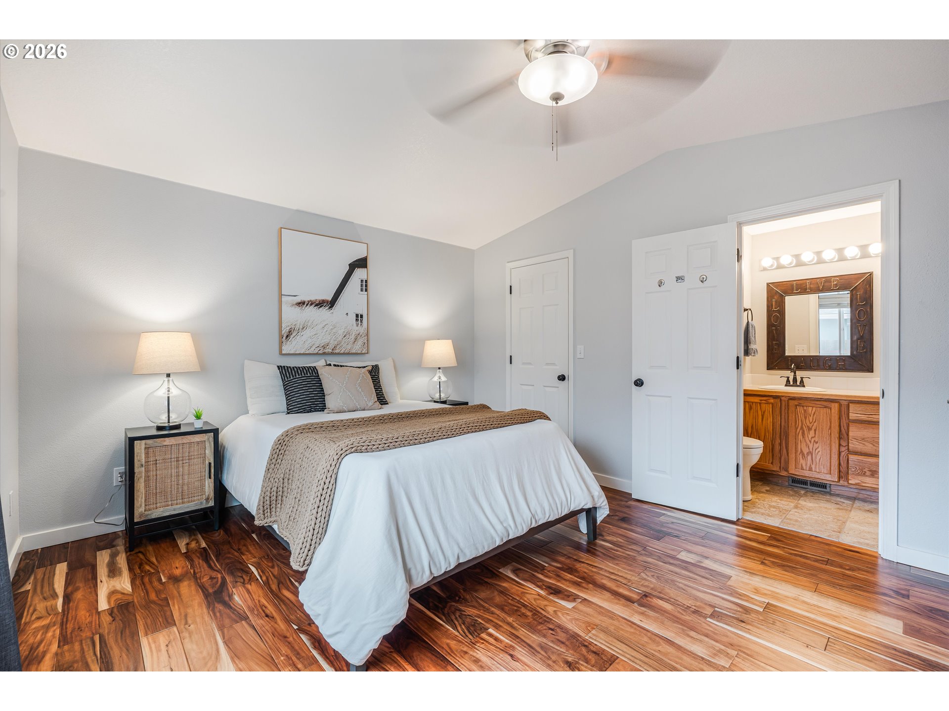 1615 Lilly Court Newberg, OR 97132 - Photo 16 of 30 a bedroom with a bed and wooden floor