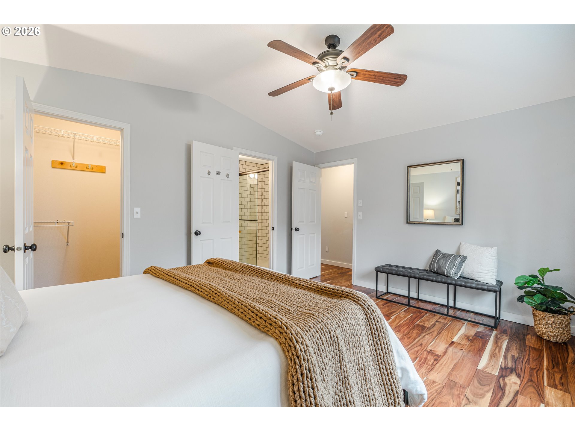 1615 Lilly Court Newberg, OR 97132 - Photo 17 of 30 a bedroom with a large bed and a chandelier