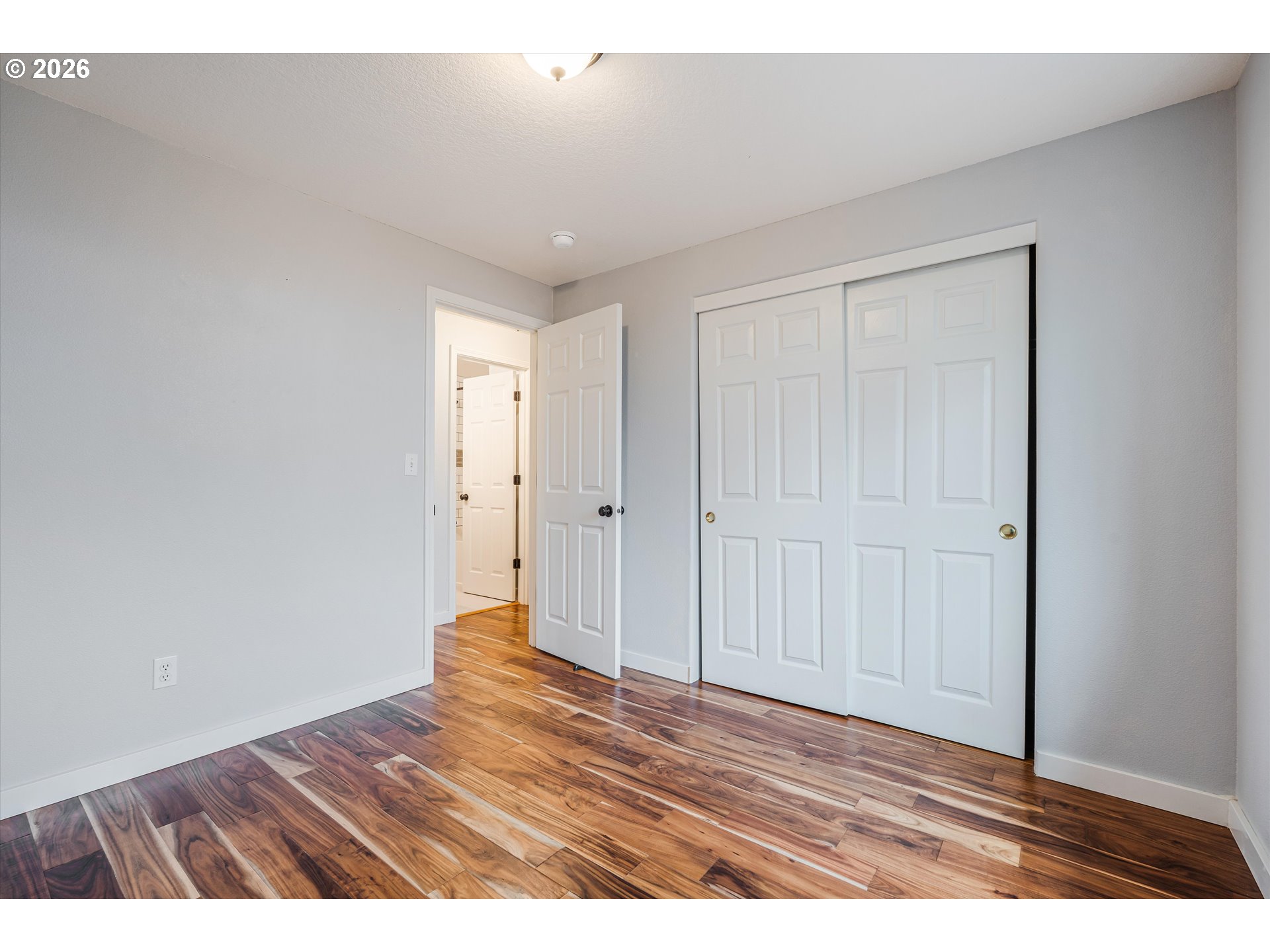1615 Lilly Court Newberg, OR 97132 - Photo 20 of 30 a view of an empty room and wooden floor