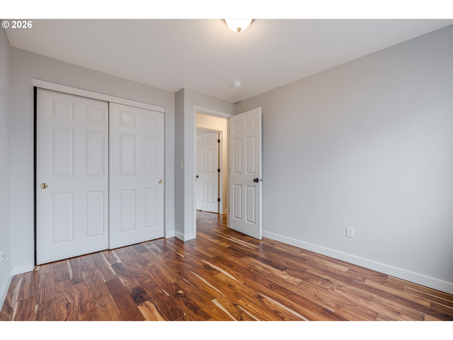 1615 Lilly Court Newberg, OR 97132 - Photo 22 of 30 a view of an empty room and wooden floor