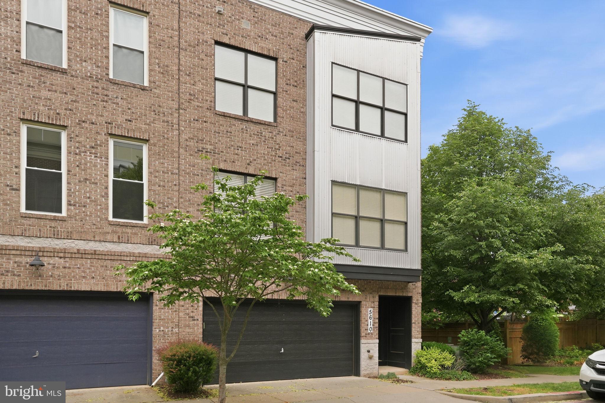 5610 Lustine Street Hyattsville, MD 20781 - Photo 2 of 36 Modern townhouse with lush greenery.