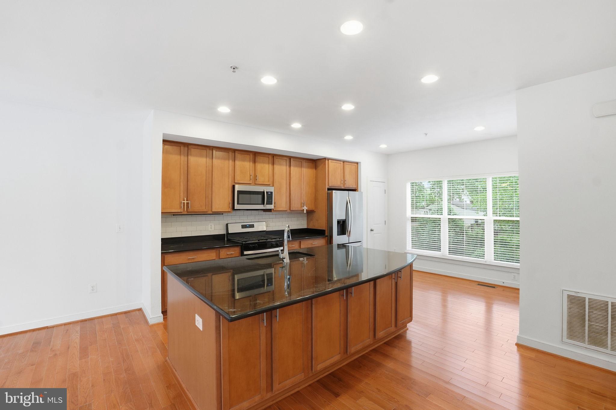 5610 Lustine Street Hyattsville, MD 20781 - Photo 3 of 36 Modern kitchen with natural light.