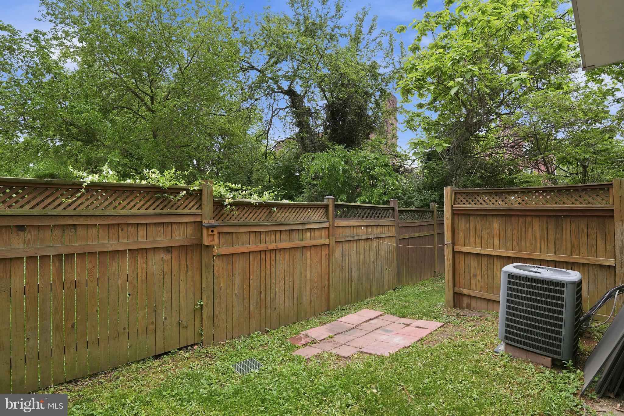 5610 Lustine Street Hyattsville, MD 20781 - Photo 33 of 36 Serene backyard retreat with greenery.