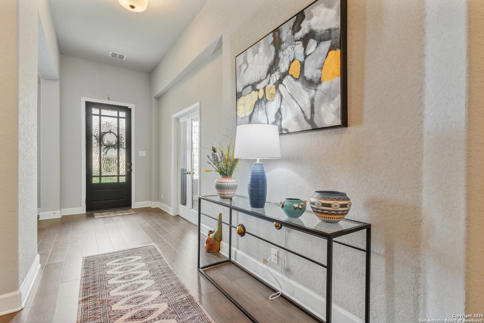 28502 Colares Way San Antonio, TX 78260 - Photo 18 of 38 a hallway with a baby crib and a dresser