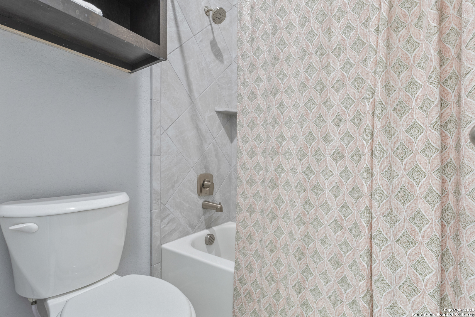 28502 Colares Way San Antonio, TX 78260 - Photo 30 of 38 a white toilet sitting next to a shower curtain