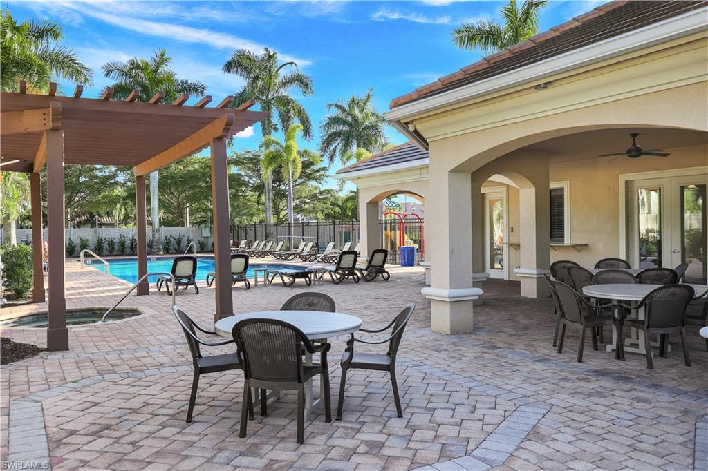 1685 Serrano Circle Naples, FL 34105 - Photo 43 of 47 Large community pool, spa, loungers plus large dining deck.
