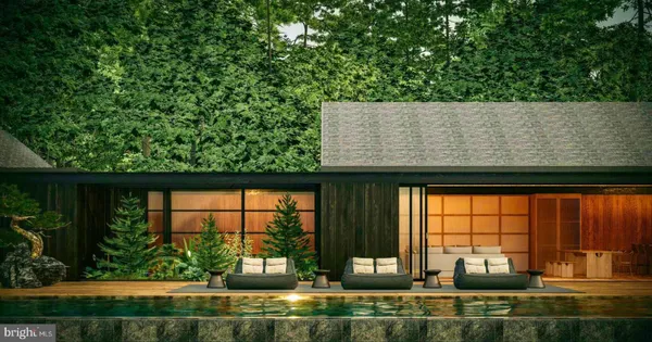 an aerial view of a houses with a yard