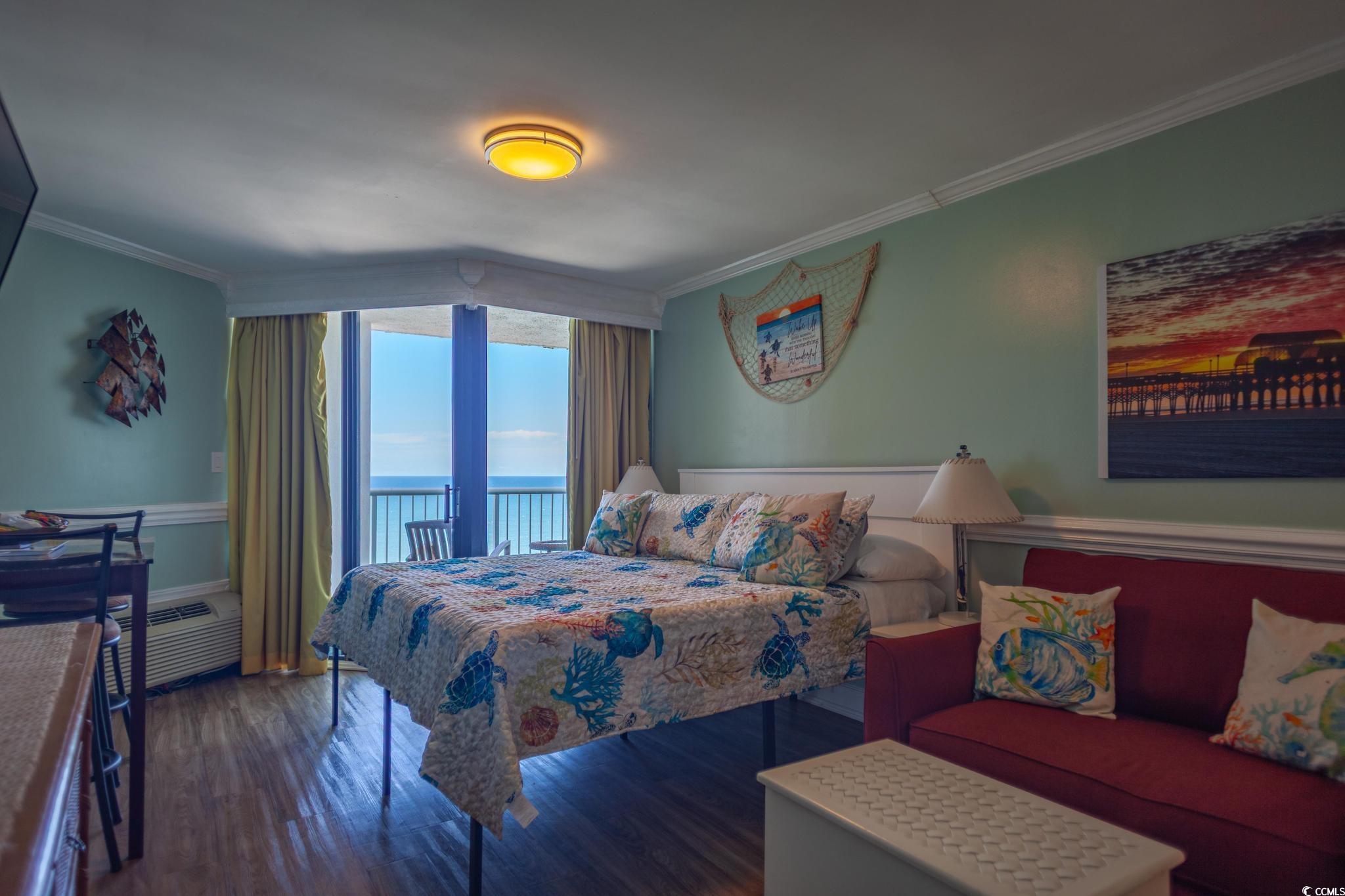 9550 Shore Drive, Unit 1728 Myrtle Beach, SC 29572 - Photo 14 of 36 Bedroom with a water view, ornamental molding, access to exterior, dark wood-style floors, and a wall mounted air conditioner