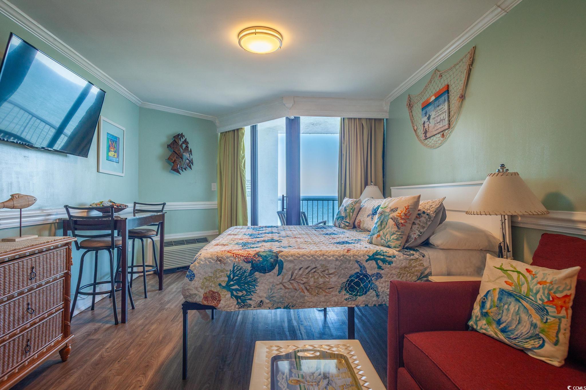 9550 Shore Drive, Unit 1728 Myrtle Beach, SC 29572 - Photo 19 of 36 Bedroom with wood finished floors and ornamental molding