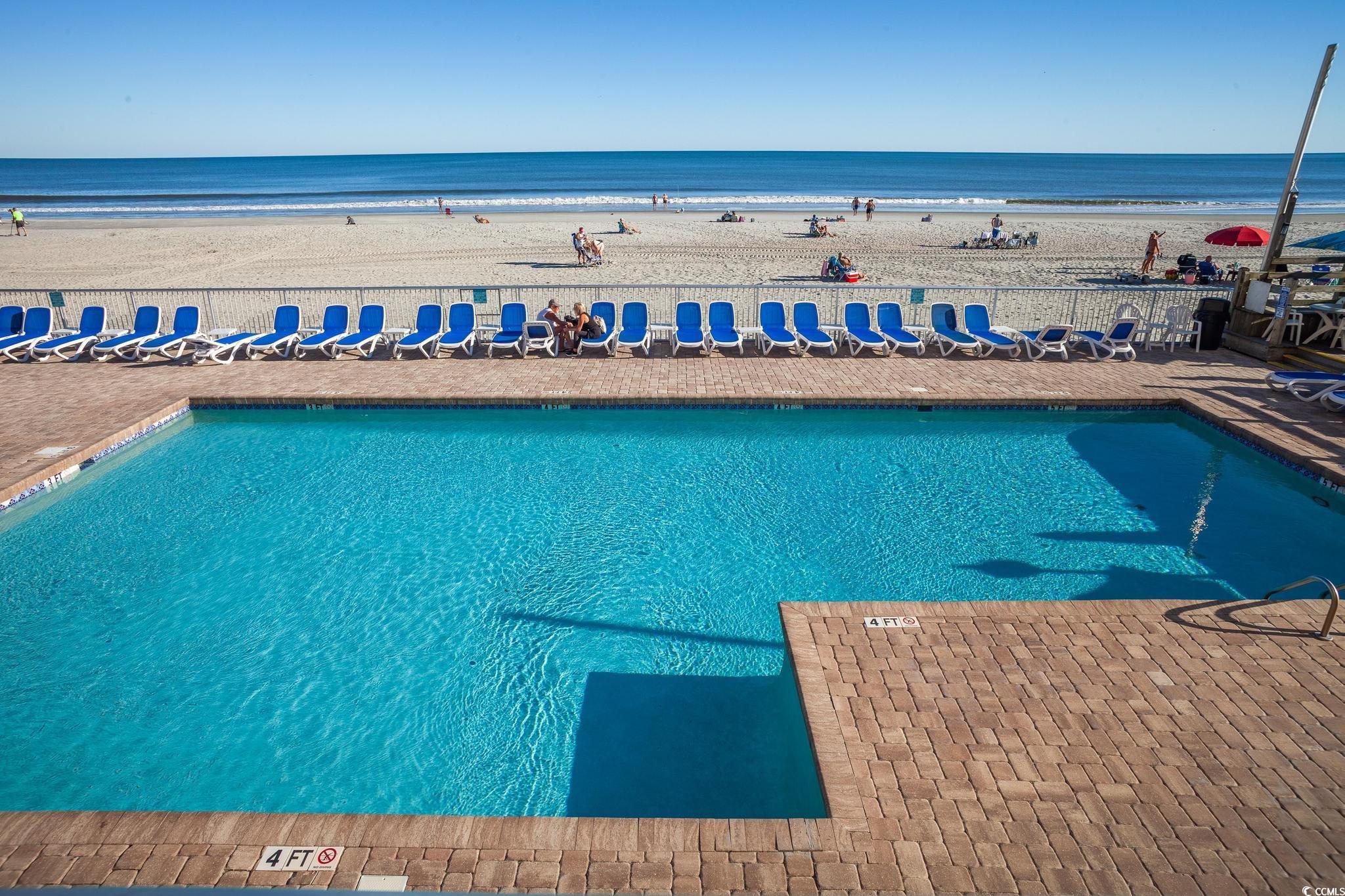 9550 Shore Drive, Unit 1728 Myrtle Beach, SC 29572 - Photo 24 of 36 Exterior space featuring view of water and beach and outdoor dining space