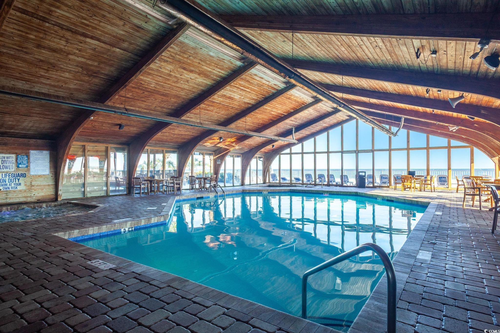 9550 Shore Drive, Unit 1728 Myrtle Beach, SC 29572 - Photo 30 of 36 Indoor pool featuring a sunroom