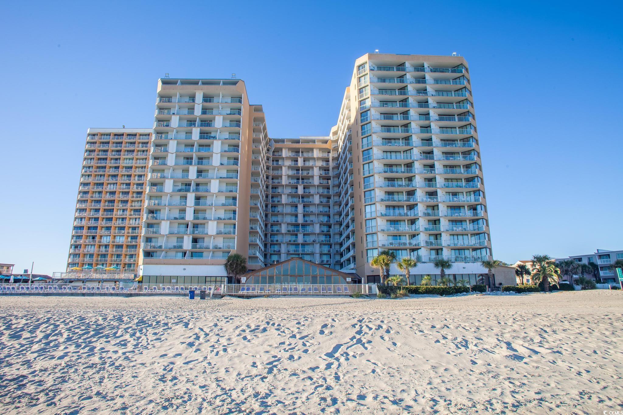 9550 Shore Drive, Unit 1728 Myrtle Beach, SC 29572 - Photo 36 of 36 Bar with an ornate ceiling and wooden walls