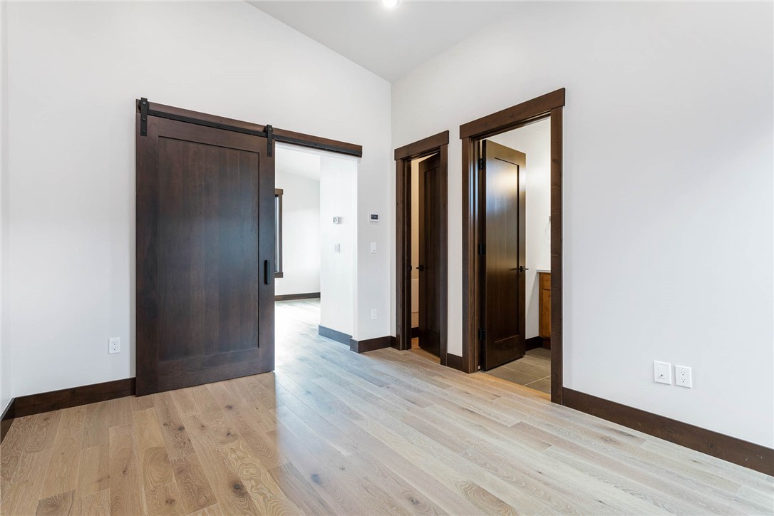 280 McKay Road Silverthorne, CO 80498 - Photo 8 of 24 an empty room with wooden floor and closet