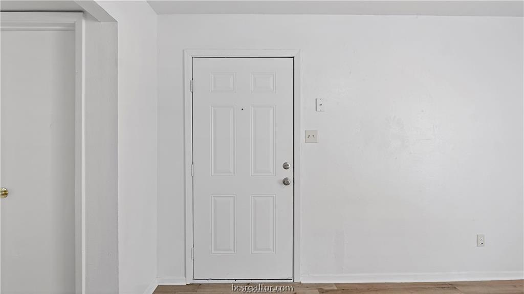 2712 Evergreen Circle Bryan, TX 77801 - Photo 7 of 30 Entryway featuring hardwood / wood-style flooring