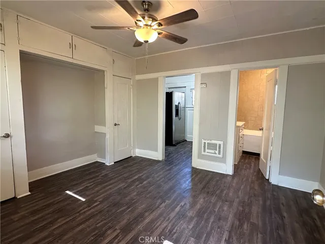a view of livingroom with hardwood floor and a ceiling fan