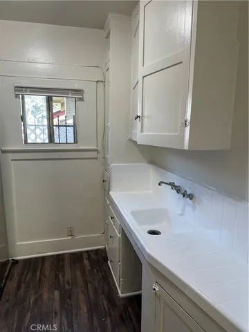 a bathroom with a sink and a window