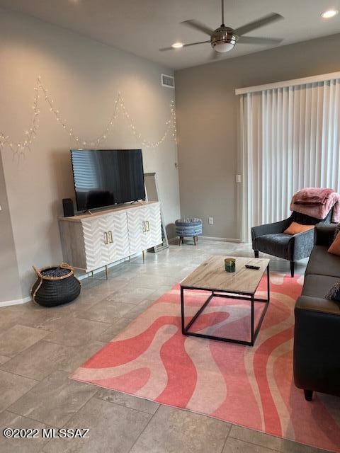 866 East Millenium Court Tucson, AZ 85719 - Photo 3 of 15 a living room with furniture and a flat screen tv