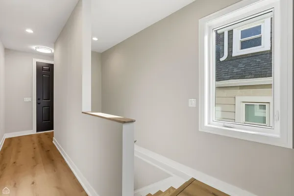 a view of a hallway with windows