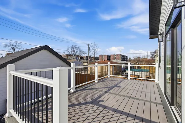 a view of a balcony with wooden floor