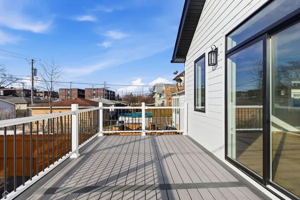 a view of a balcony with wooden floor