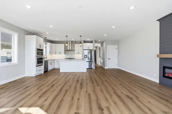 a view of kitchen and wooden floor