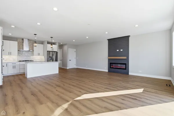 a view of kitchen view and wooden floor
