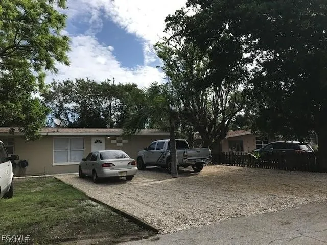 a view of a car parked in front of a house