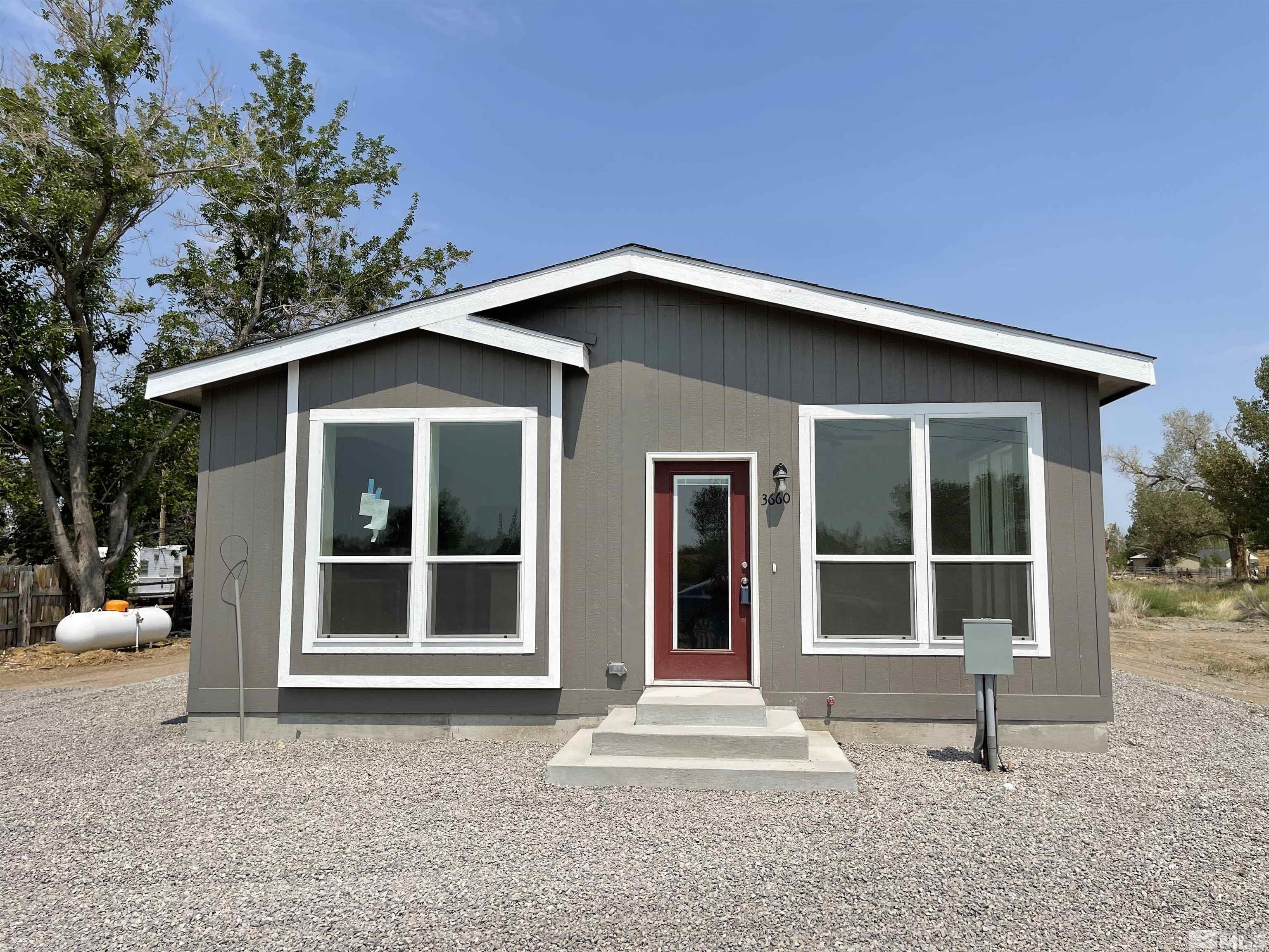 3660 Bottom Road Fallon, NV 89406 - Photo 1 of 13 a house with trees in the background