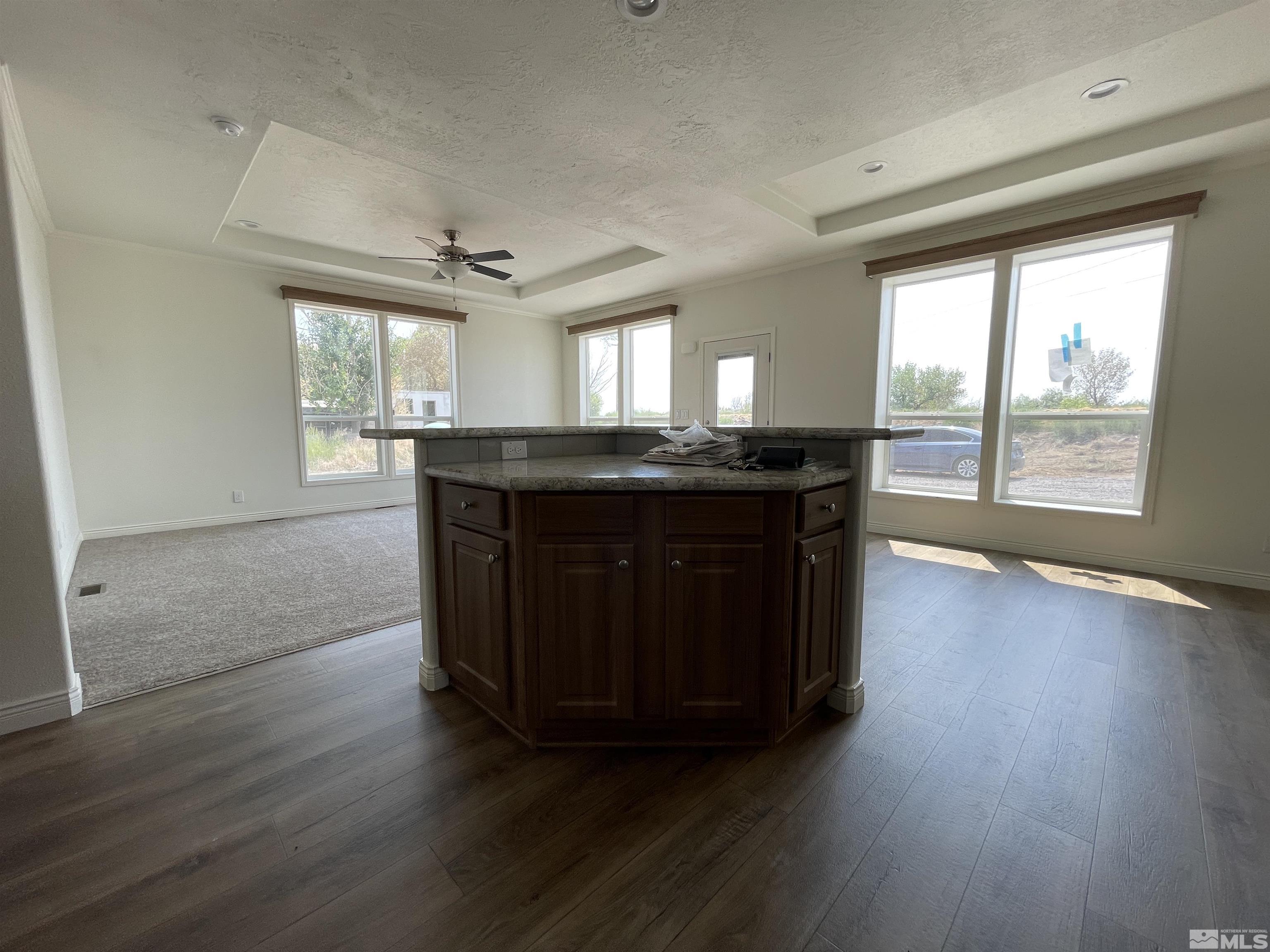 3660 Bottom Road Fallon, NV 89406 - Photo 6 of 13 a kitchen with granite countertop a stove a sink and wooden floor