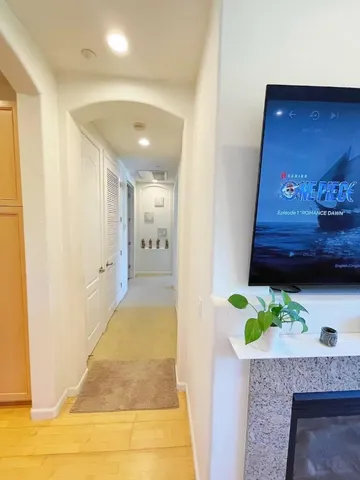 a view of hallway with wooden floor