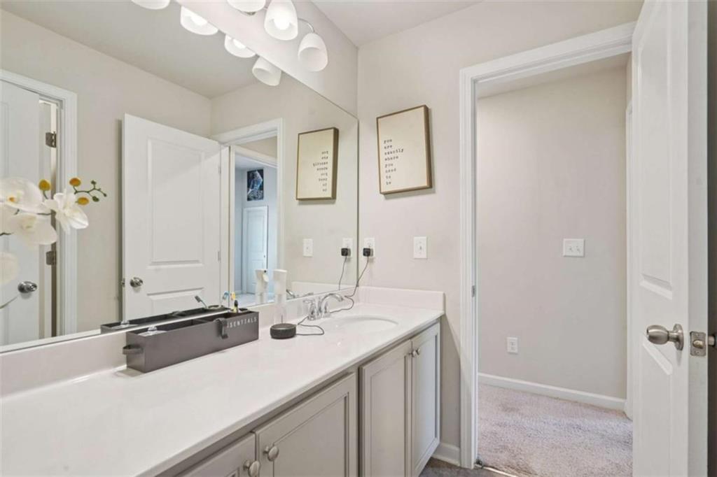 3605 Broadwick Lane Lithonia, GA 30038 - Photo 18 of 41 a bathroom with a sink vanity granite and a mirror