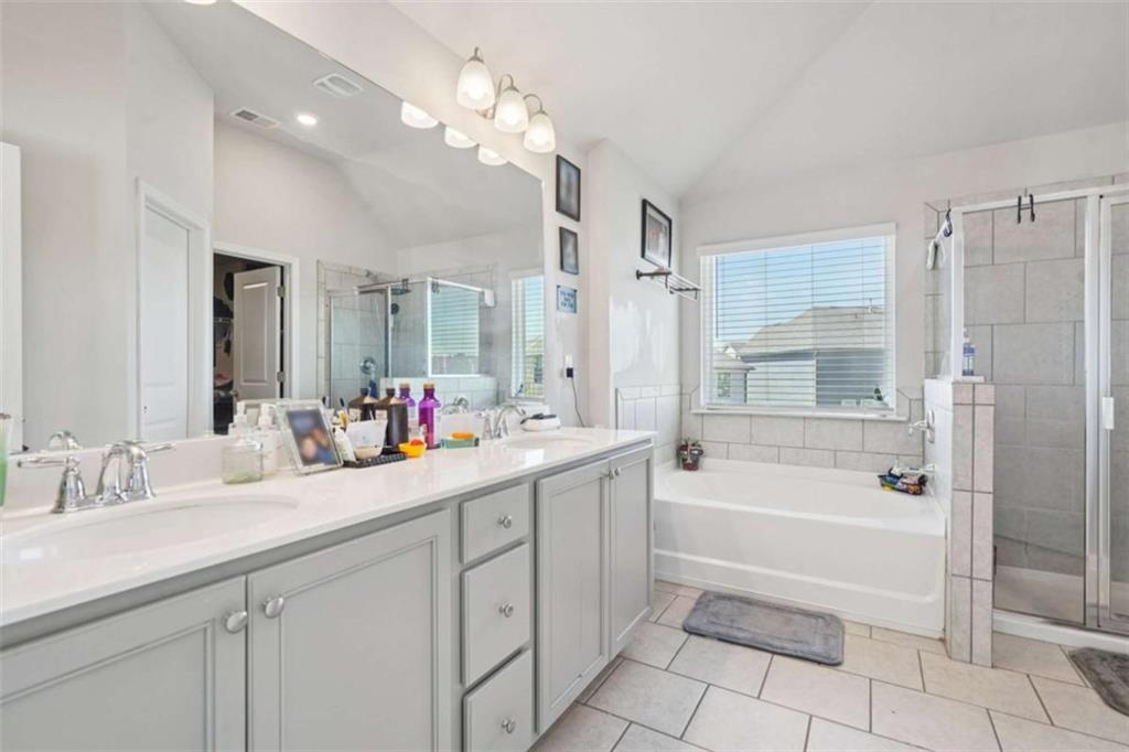 3605 Broadwick Lane Lithonia, GA 30038 - Photo 19 of 41 a bathroom with a tub a sink double vanity and a mirror
