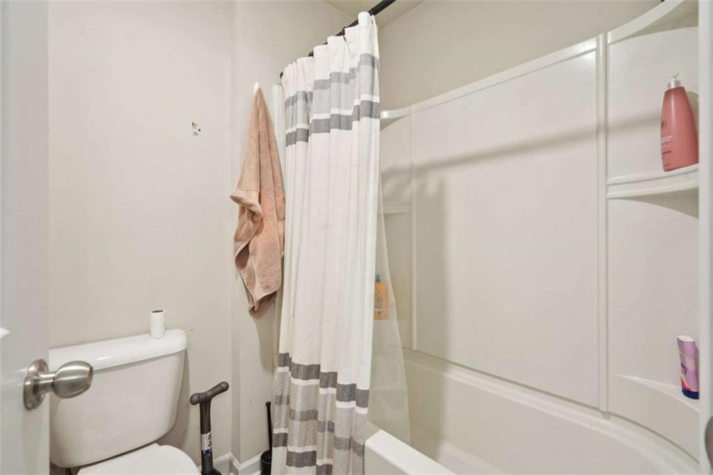 3605 Broadwick Lane Lithonia, GA 30038 - Photo 20 of 41 a bathroom with a shower a toilet and a sink