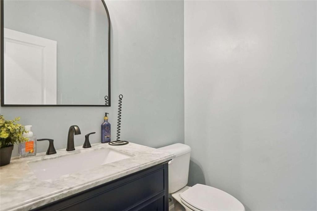 3605 Broadwick Lane Lithonia, GA 30038 - Photo 21 of 41 a bathroom with a granite countertop sink and a toilet