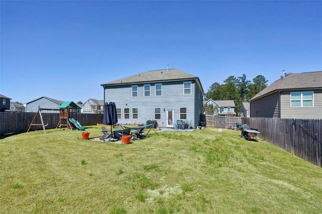 3605 Broadwick Lane Lithonia, GA 30038 - Photo 23 of 41 a view of a house with backyard porch and sitting area