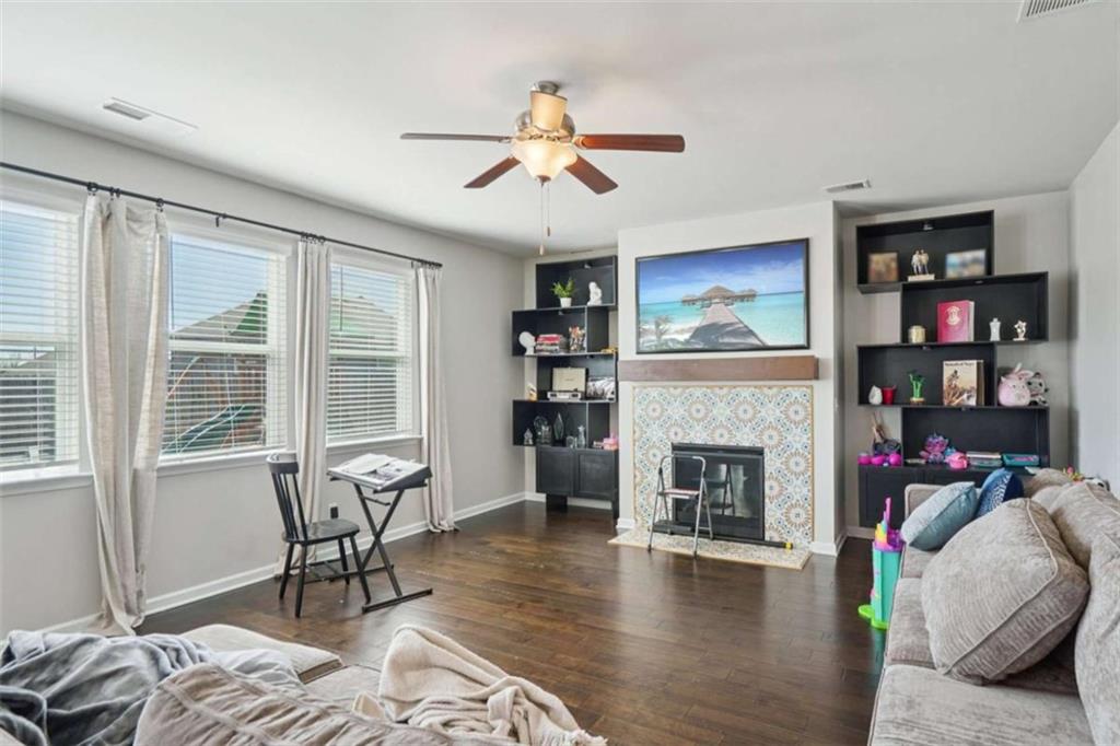 3605 Broadwick Lane Lithonia, GA 30038 - Photo 6 of 41 a living room with furniture and a fireplace