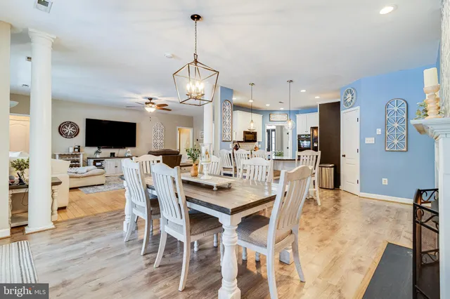 a bathroom with double vanity sink a mirror and a shower