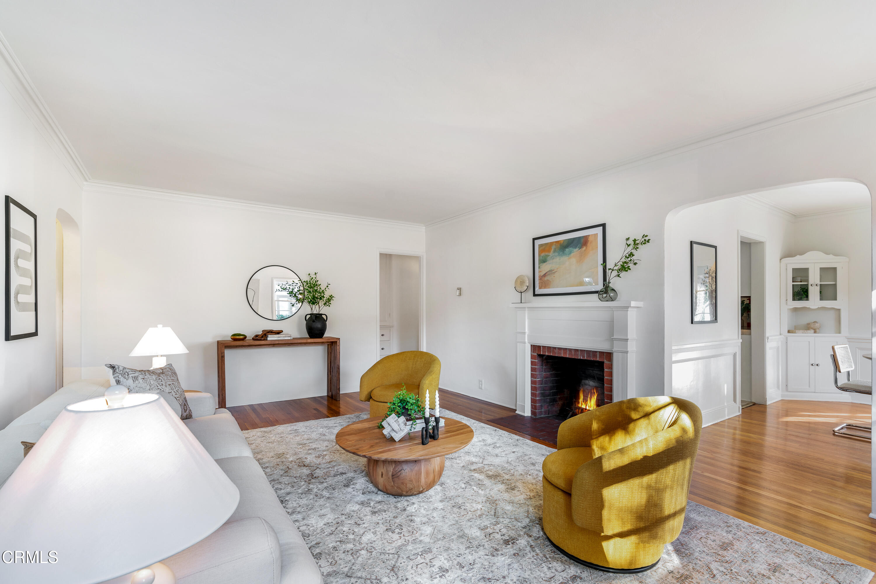 990 Bella Vista Avenue Pasadena, CA 91107 - Photo 3 of 16 a living room with furniture and a fireplace