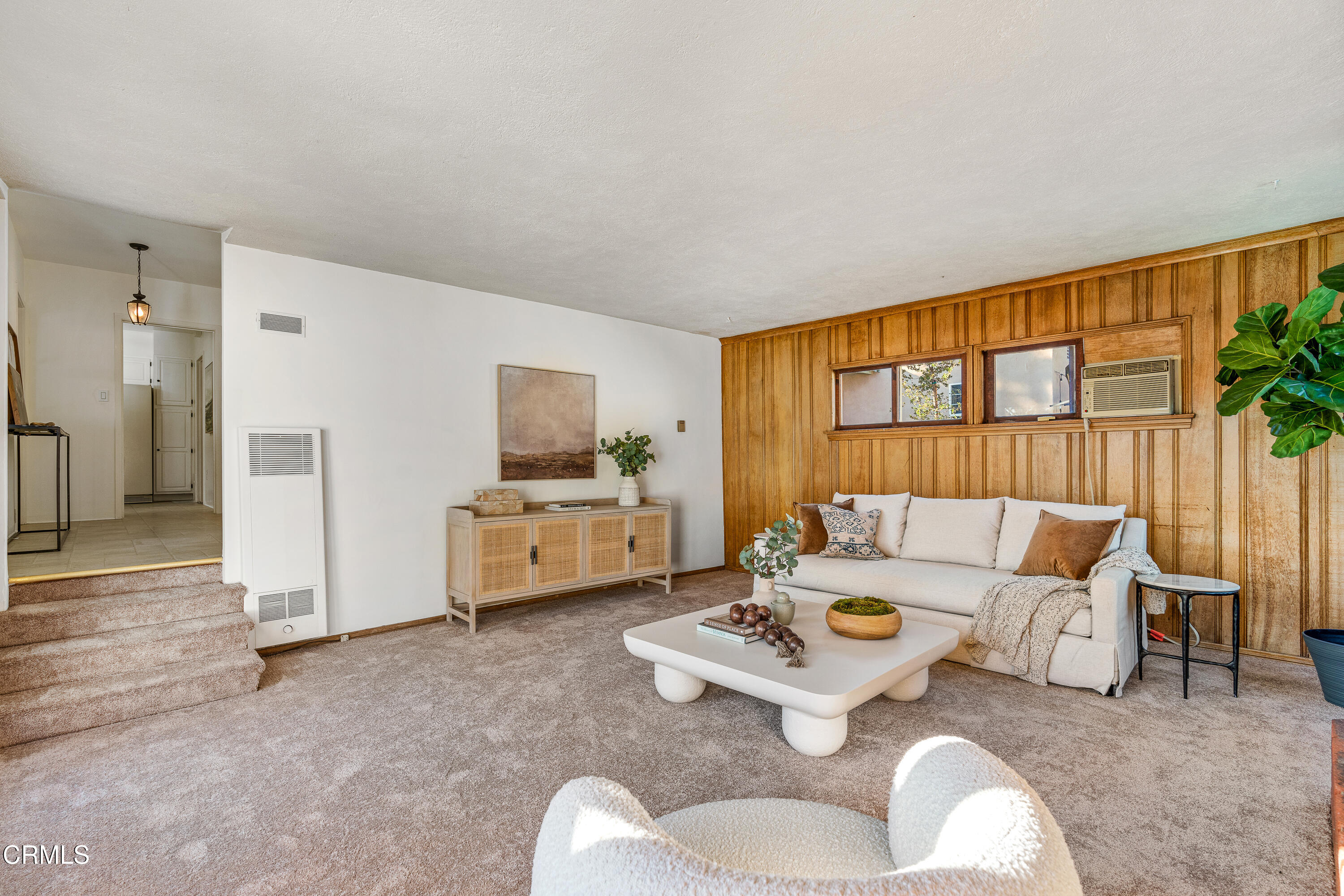 990 Bella Vista Avenue Pasadena, CA 91107 - Photo 5 of 16 a living room with furniture and a large window