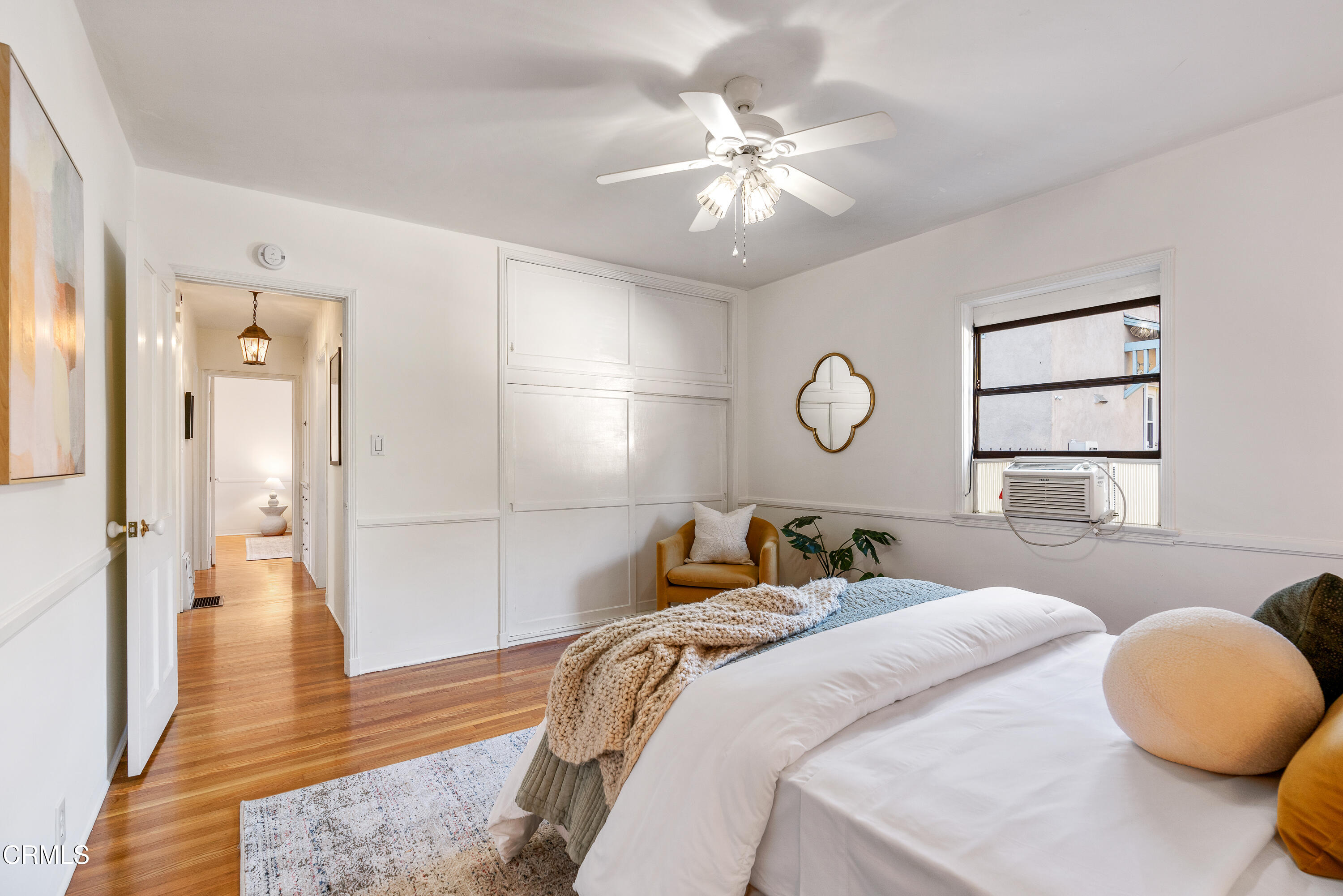 990 Bella Vista Avenue Pasadena, CA 91107 - Photo 8 of 16 a bedroom with a bed and wooden floor