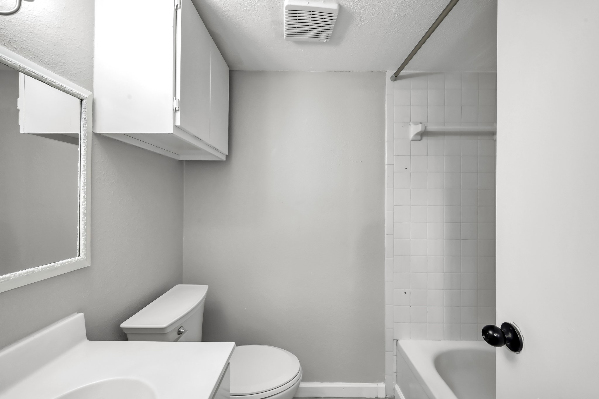 12900 Walden Road, Unit 604F Montgomery, TX 77356 - Photo 15 of 19 a white toilet sitting next to a bathroom sink