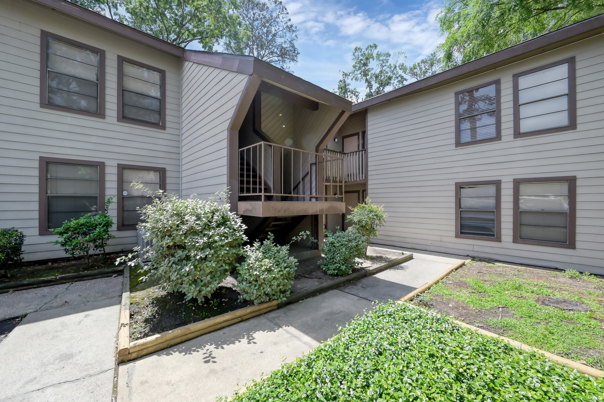 12900 Walden Road, Unit 604F Montgomery, TX 77356 - Photo 18 of 19 a front view of a house with garden