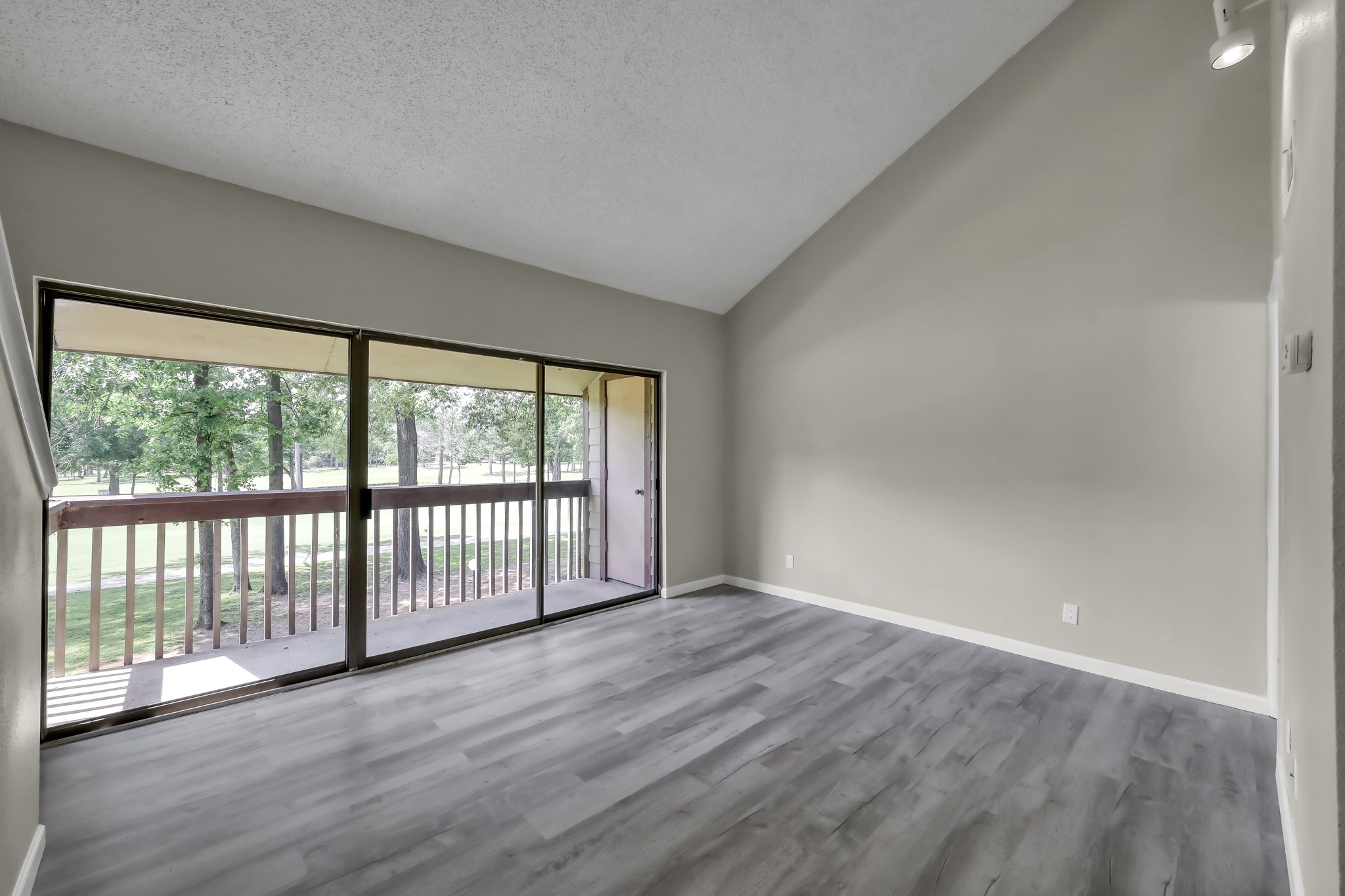 12900 Walden Road, Unit 604F Montgomery, TX 77356 - Photo 7 of 19 wooden floor in an empty room with a window