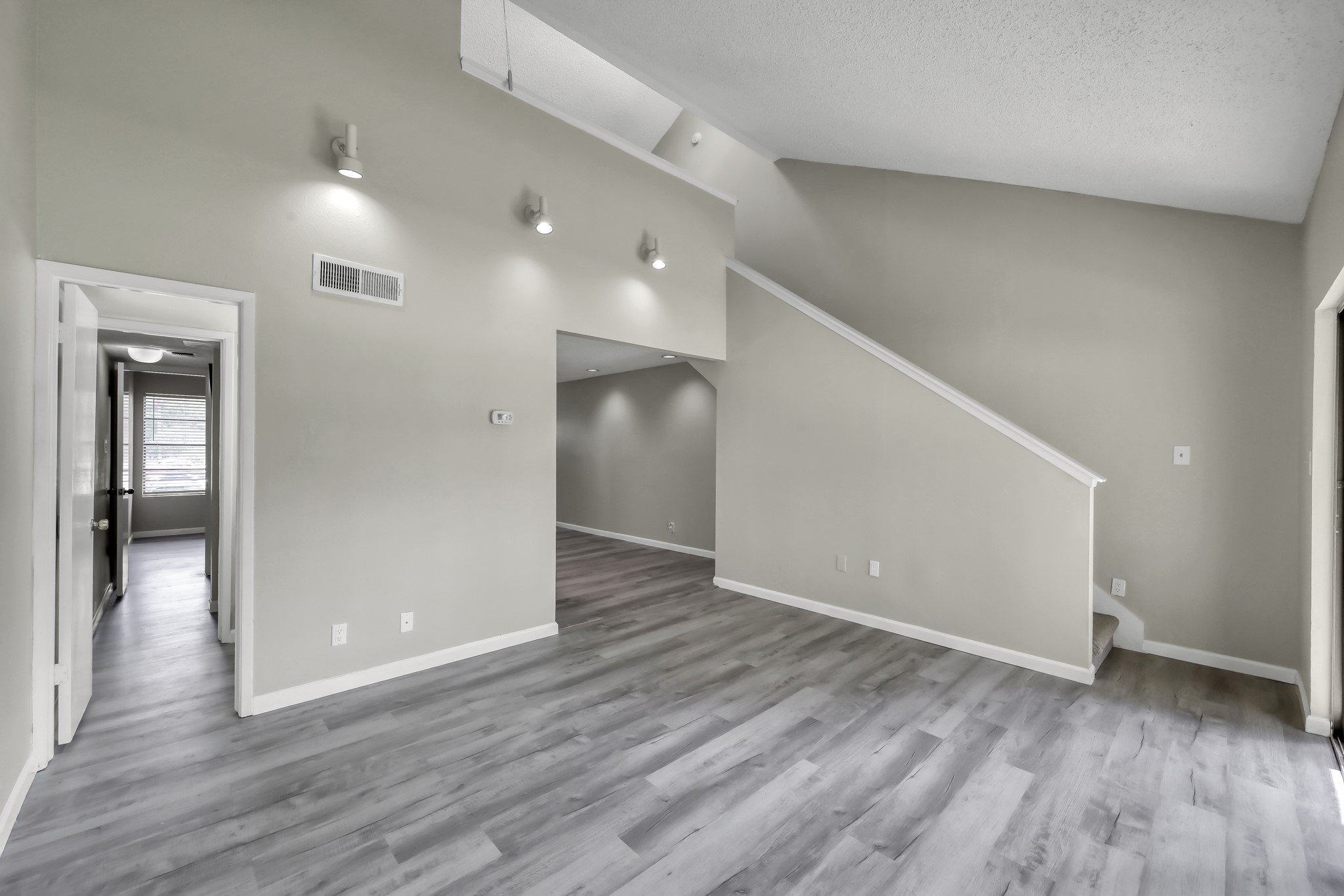 12900 Walden Road, Unit 604F Montgomery, TX 77356 - Photo 8 of 19 a view of an empty room with wooden floor