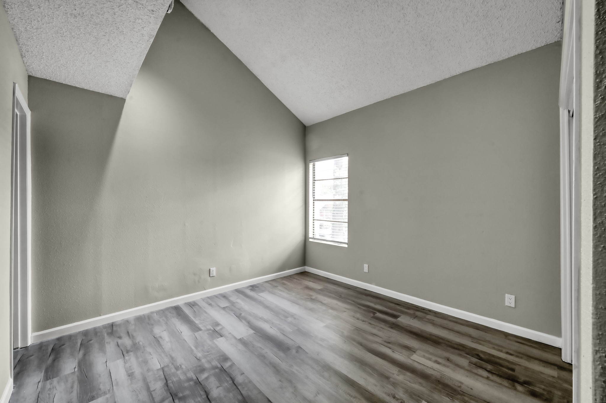 12900 Walden Road, Unit 604F Montgomery, TX 77356 - Photo 9 of 19 a view of empty room with wooden floor
