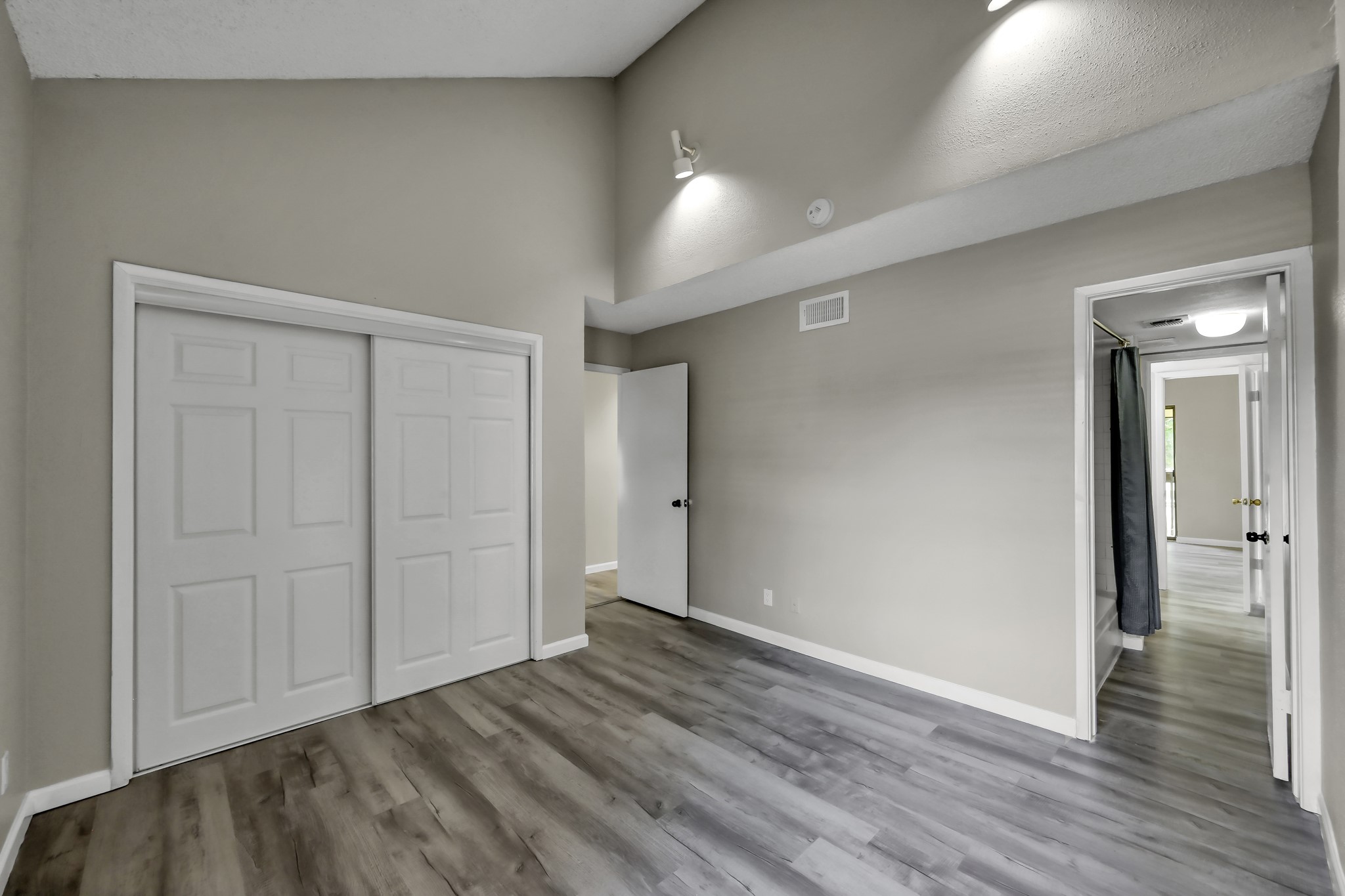 12900 Walden Road, Unit 604F Montgomery, TX 77356 - Photo 10 of 19 wooden floor in an empty room