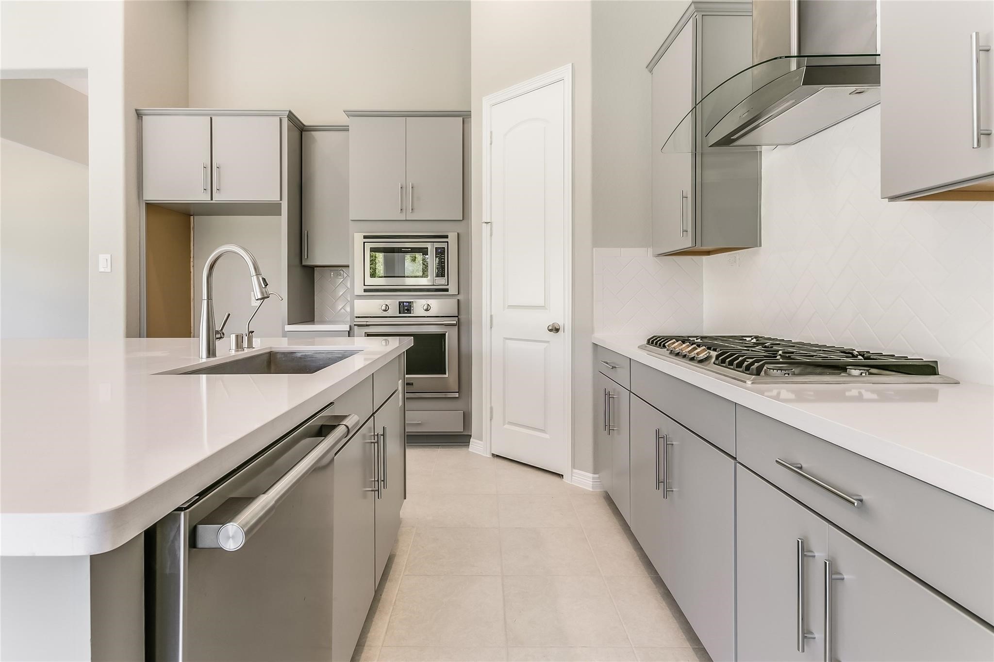 4227 Carol Ridge Drive Sugar Land, TX 77479 - Photo 10 of 35 a kitchen with stainless steel appliances granite countertop a sink stove refrigerator and cabinets