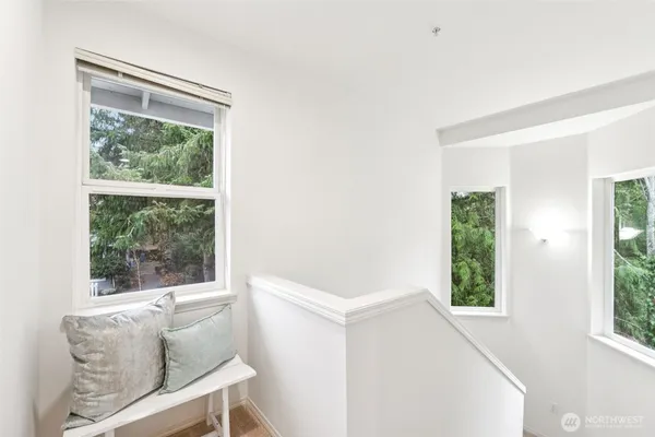 a bedroom with a bed chair and a window